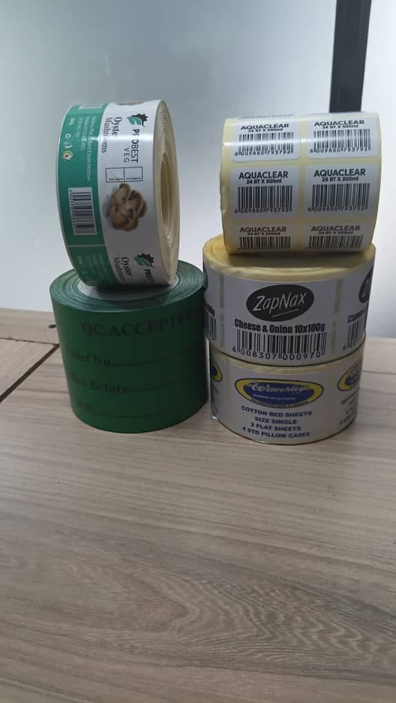 Rolls of custom printed product and barcode labels made by Absolute Packaging